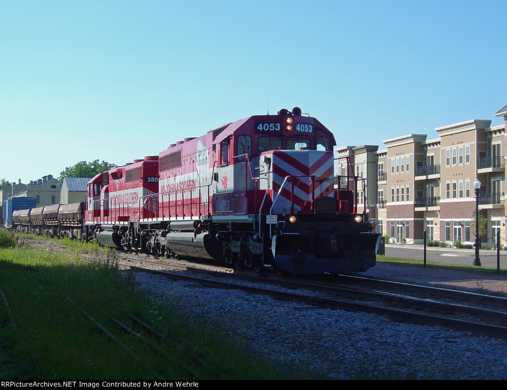 WSOR 4053 passing some new buildings downtown